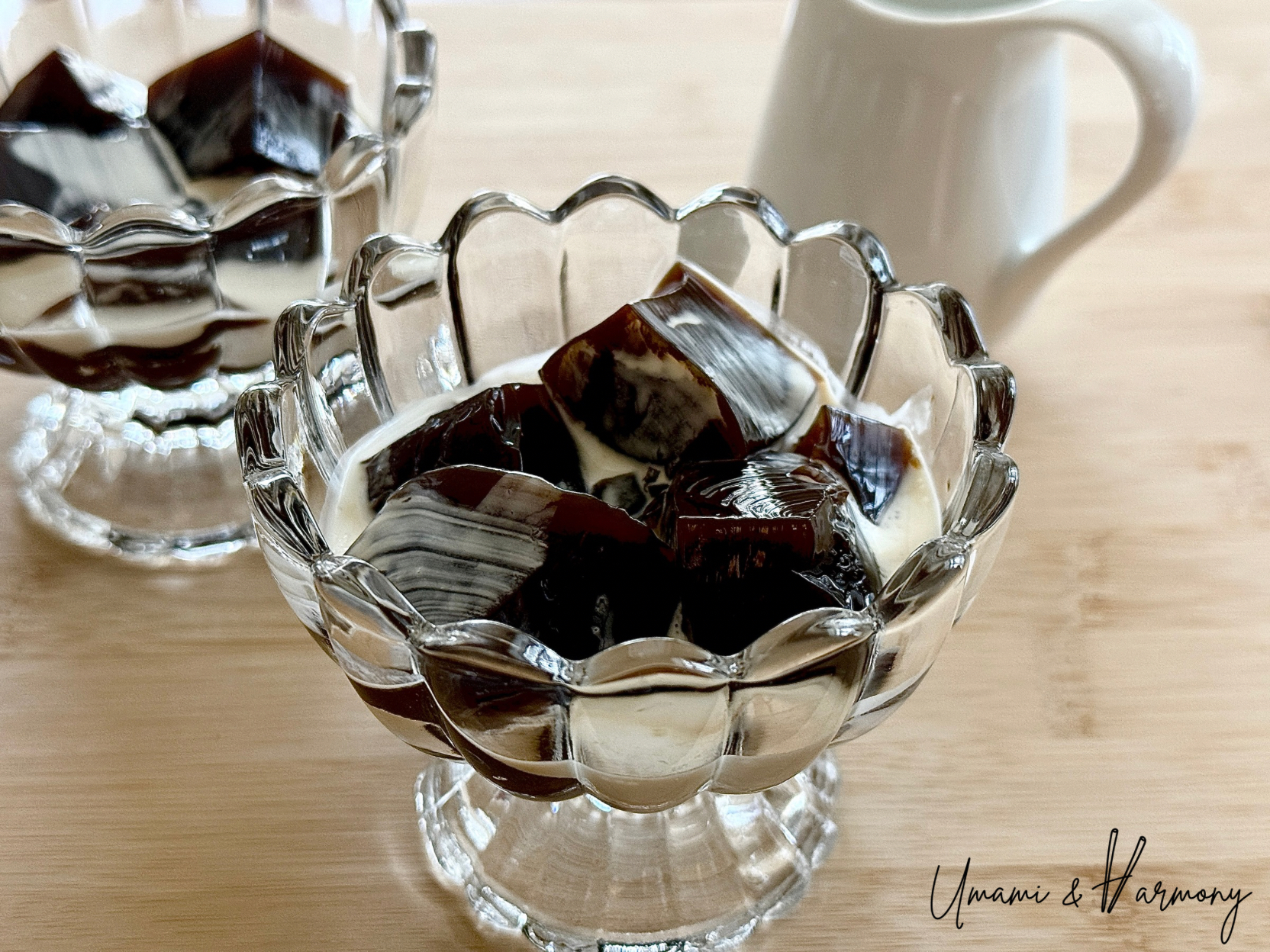 Coffee jelly cut into cubes served with heavy cream