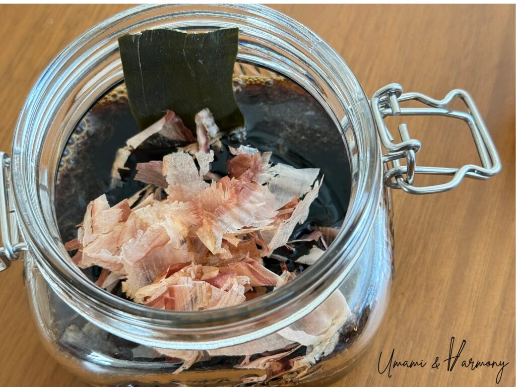 Kombu and bonito flakes added to ponzu mixture in a jar