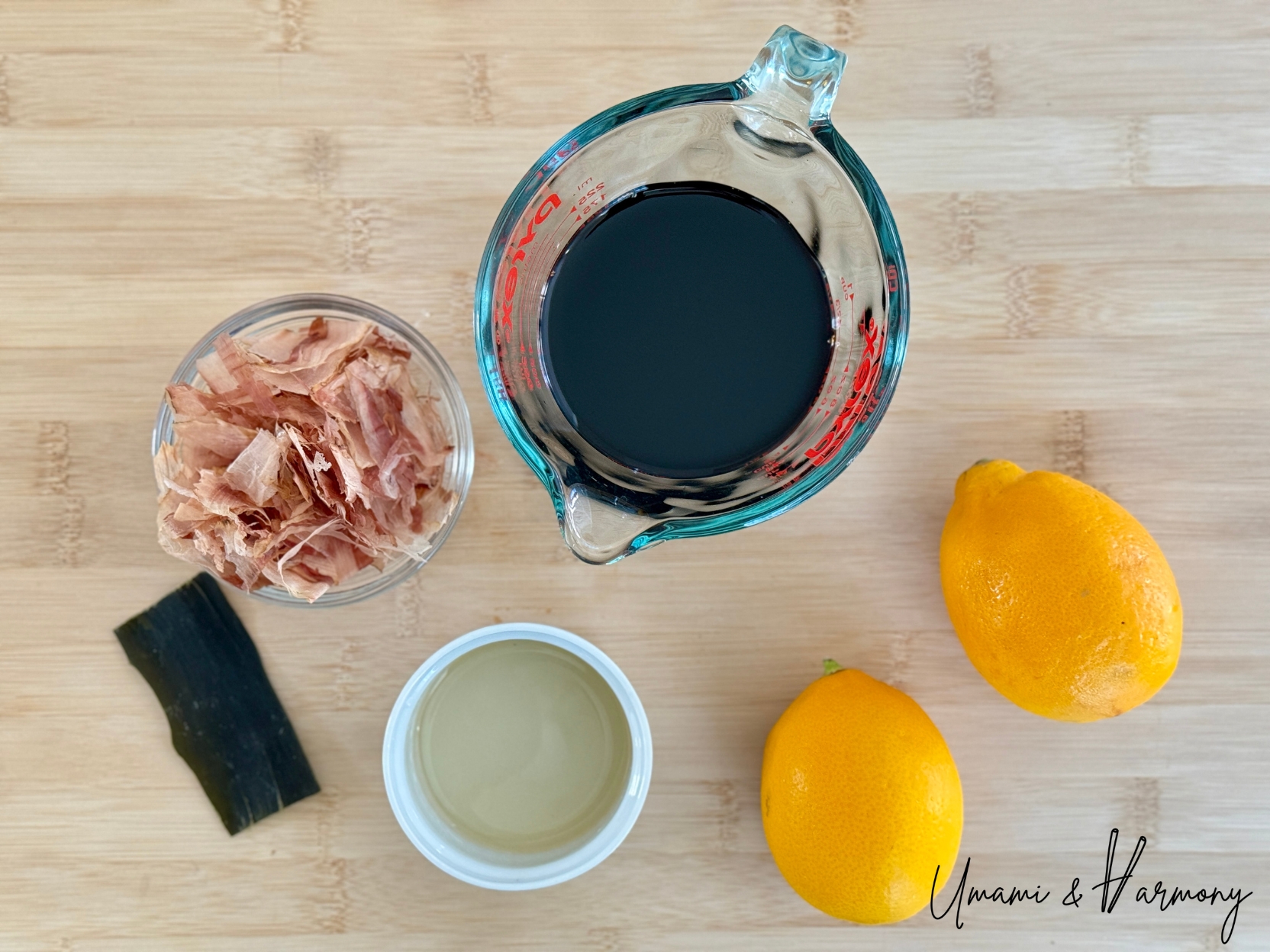 Ingredients for homemade ponzu including Meyer lemon, soy sauce, mirin, kombu, and bonito flakes