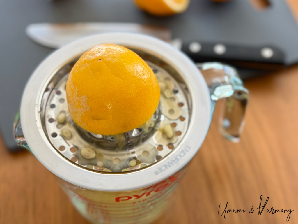 Meyer lemons being squeezed 