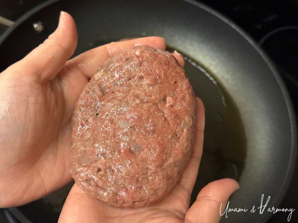 Hamburg steak patties shaped into oval portions by hand