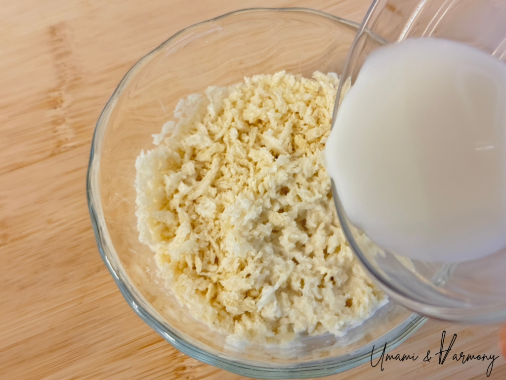 Milk being poured into panko breadcrumbs