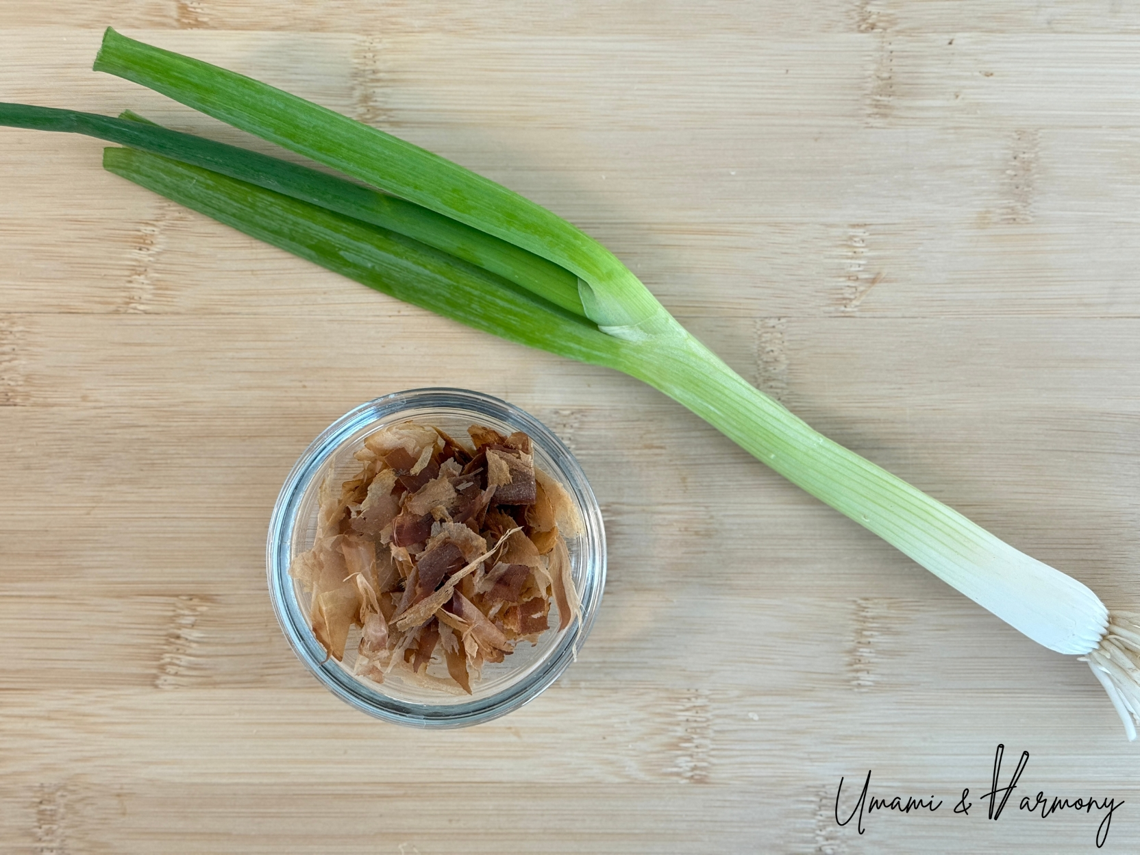 Bonito flakes and chopped green onion for garnish for ninjin shirishiri