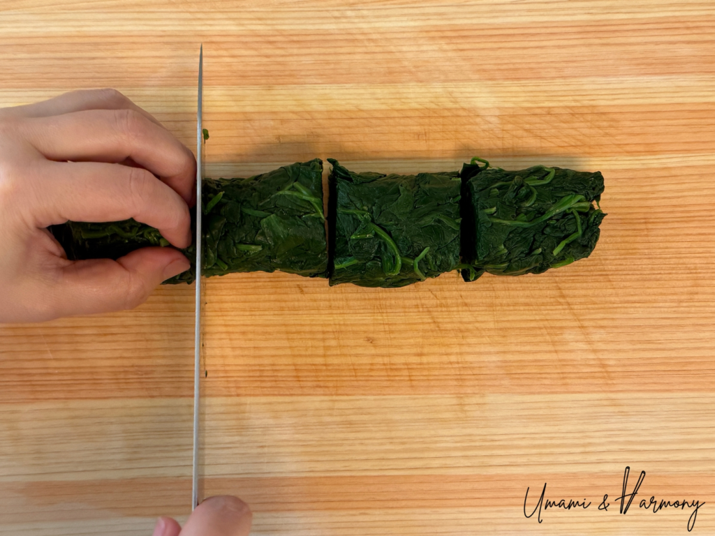 Spinach cut into bite-size pieces and placed in a container