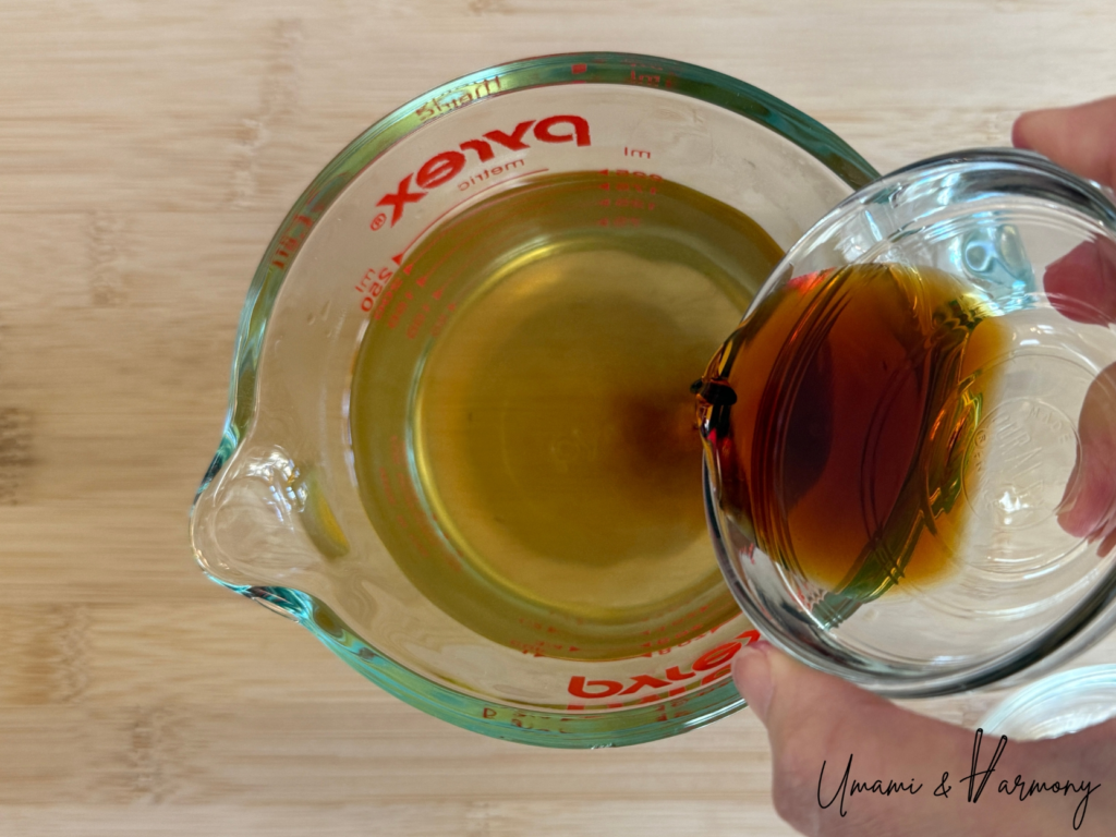 Soy sauce and mirin being poured into dashi broth