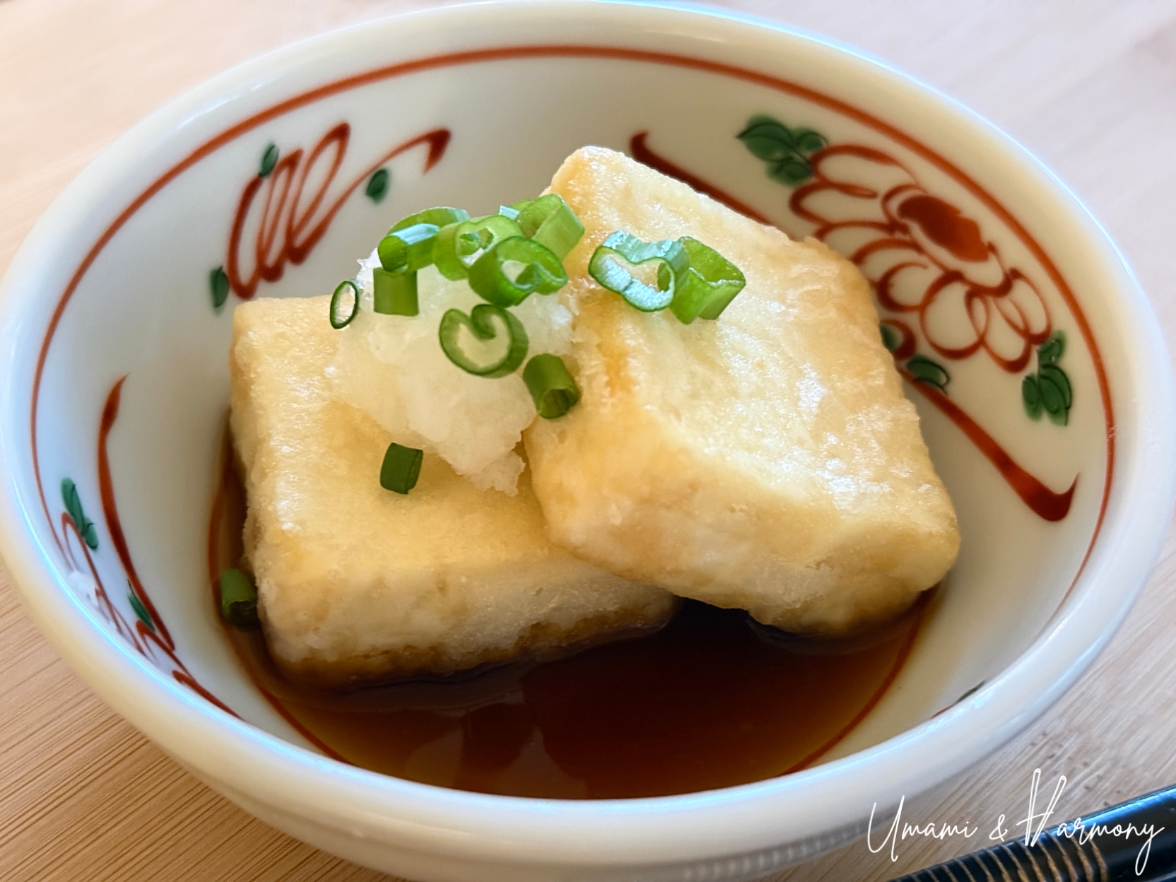 Agedashi tofu ready to serve with dashi sauce and garnish