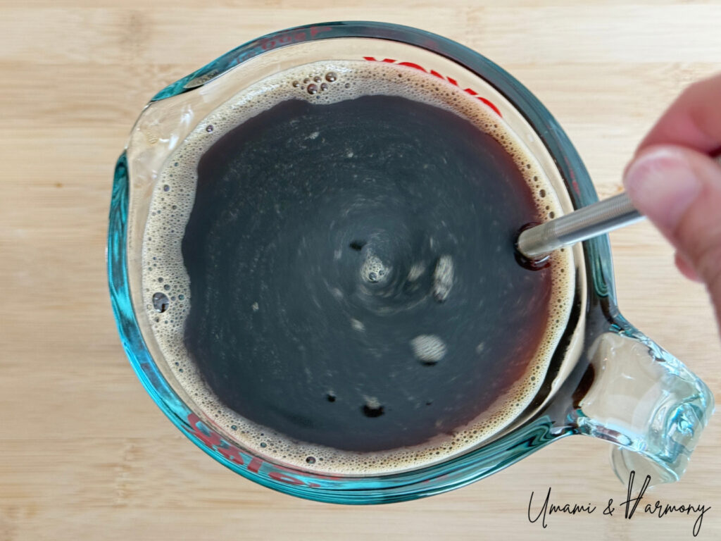 Coffee mixture being stirred until gelatin is well combined 