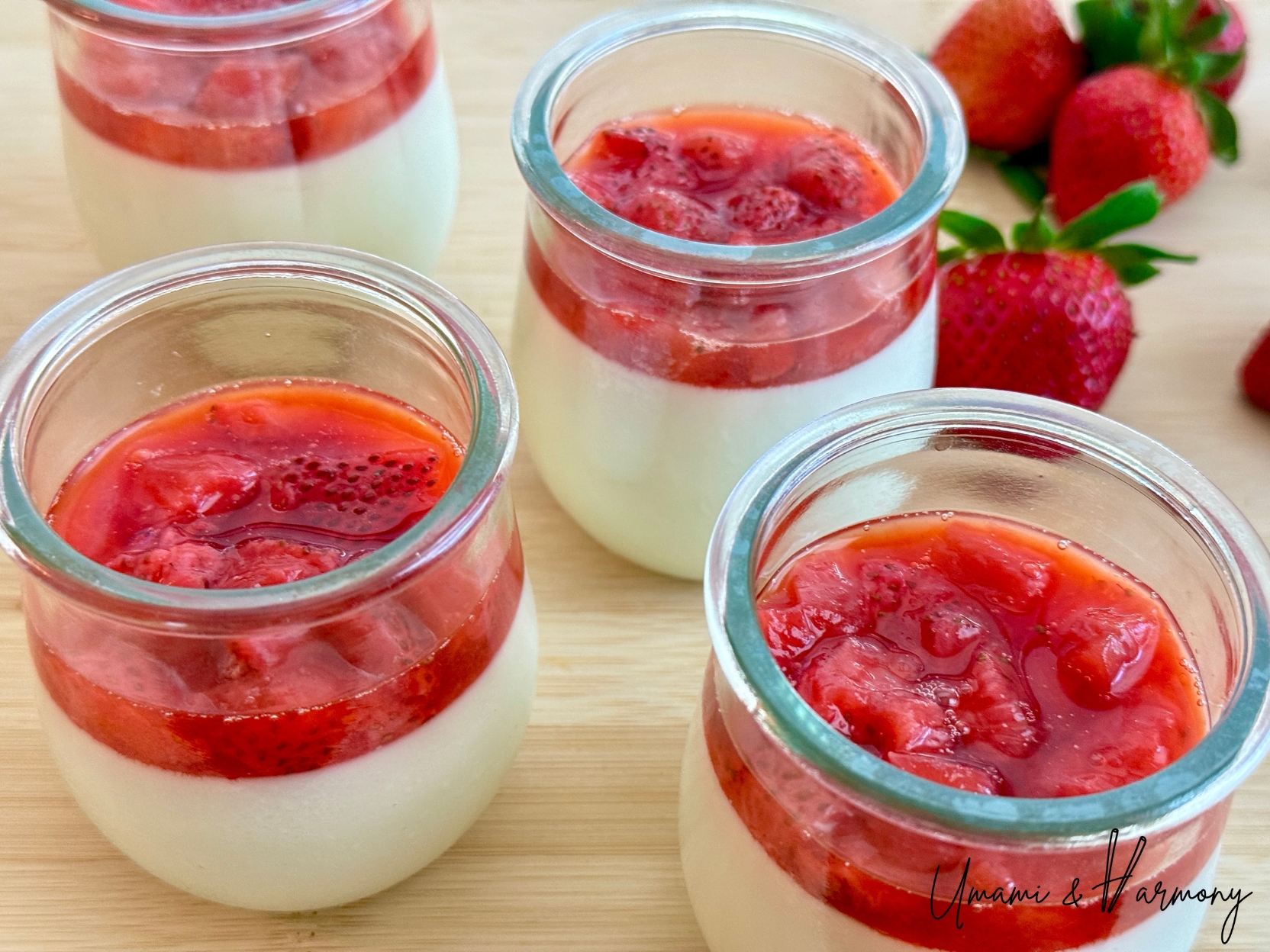 Strawberry panna cotta with fresh strawberry sauce in a glass