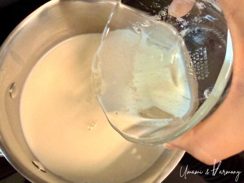 Gelatin being added to panna cotta mixture