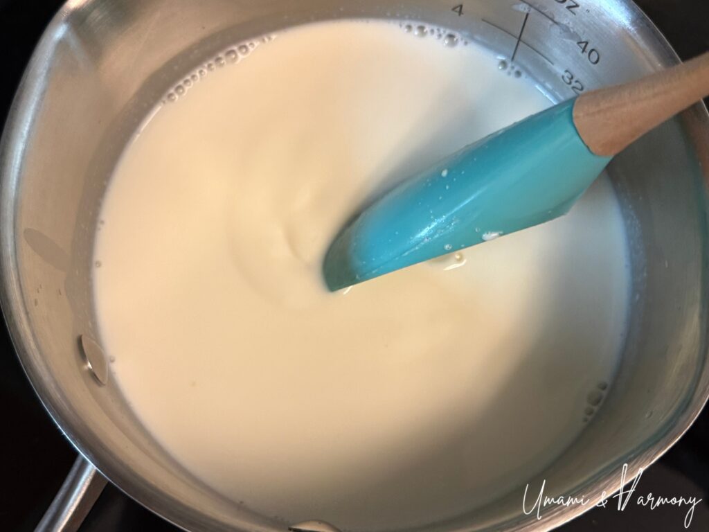 Panna cotta mixture being stirred until smooth