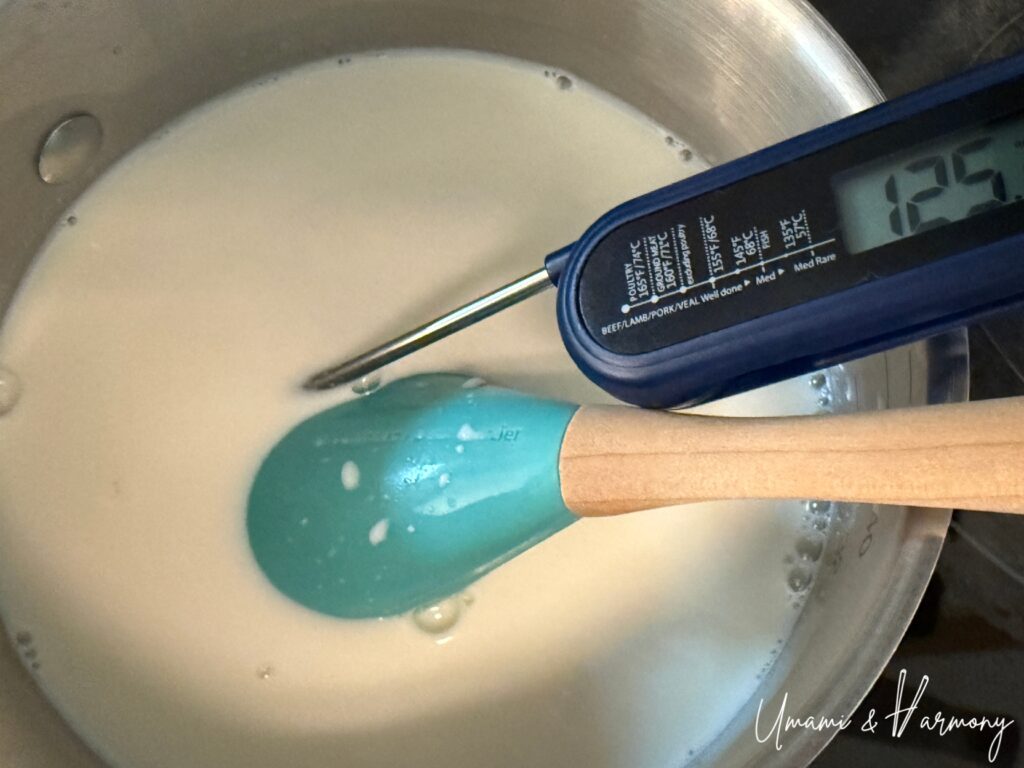 Panna cotta mixture heated to 125°F in a pot