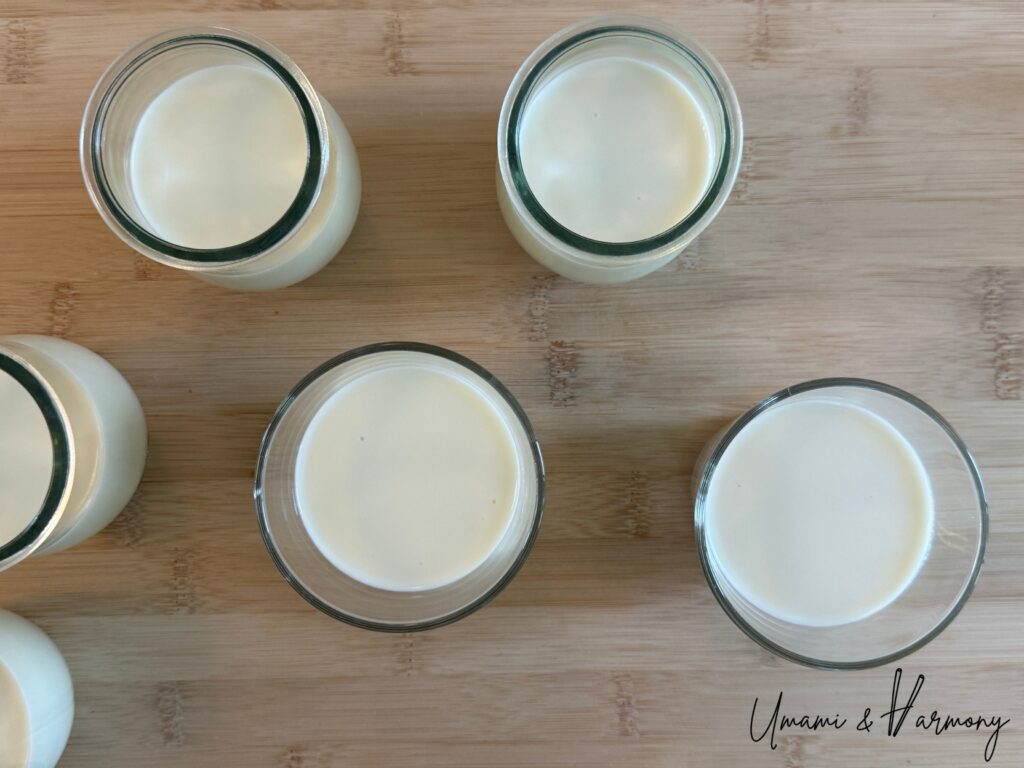 Panna cotta mixture poured into dessert cups