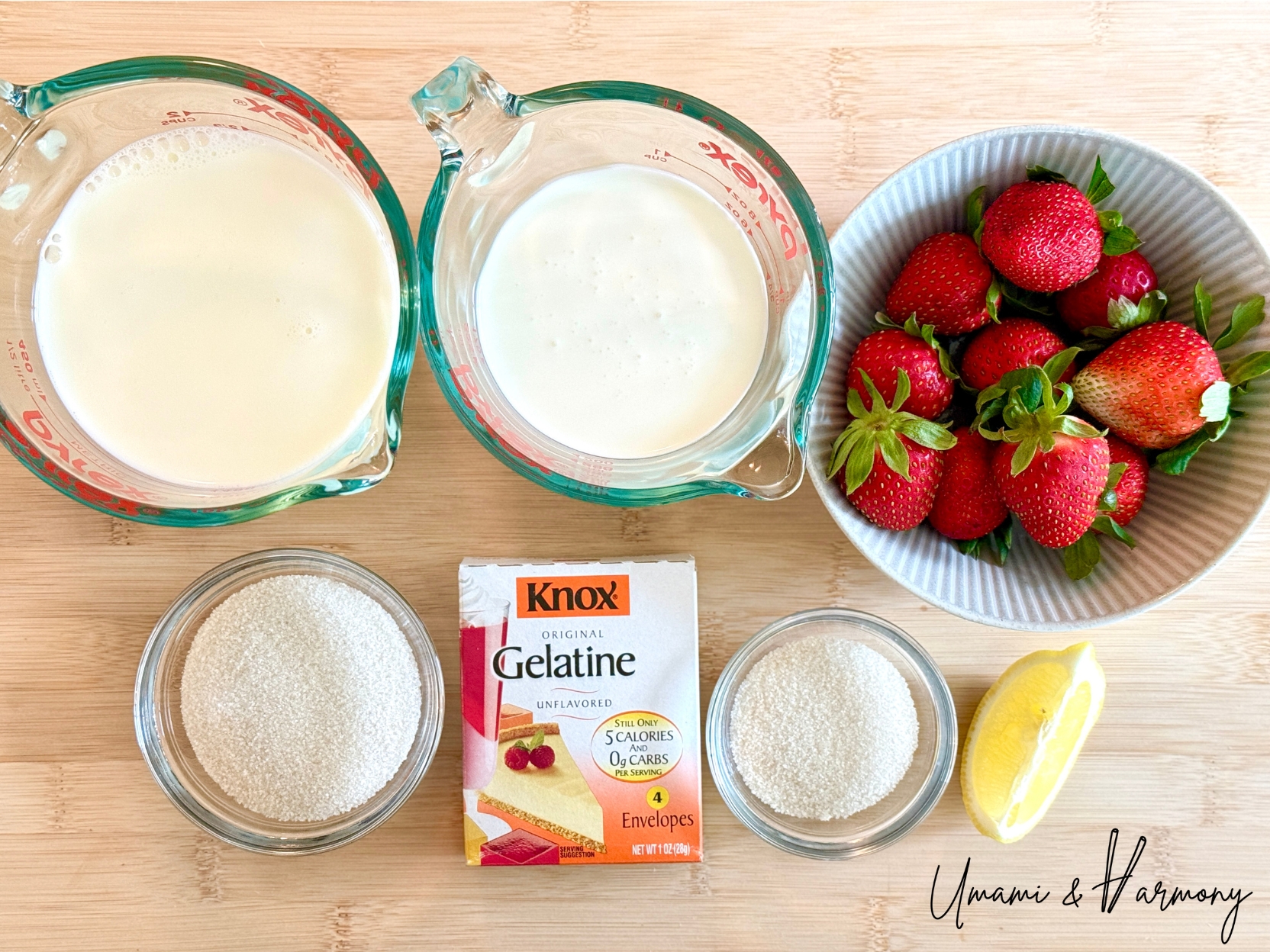Ingredients for strawberry panna cotta including milk, cream, gelatin, sugar, lemon and strawberries