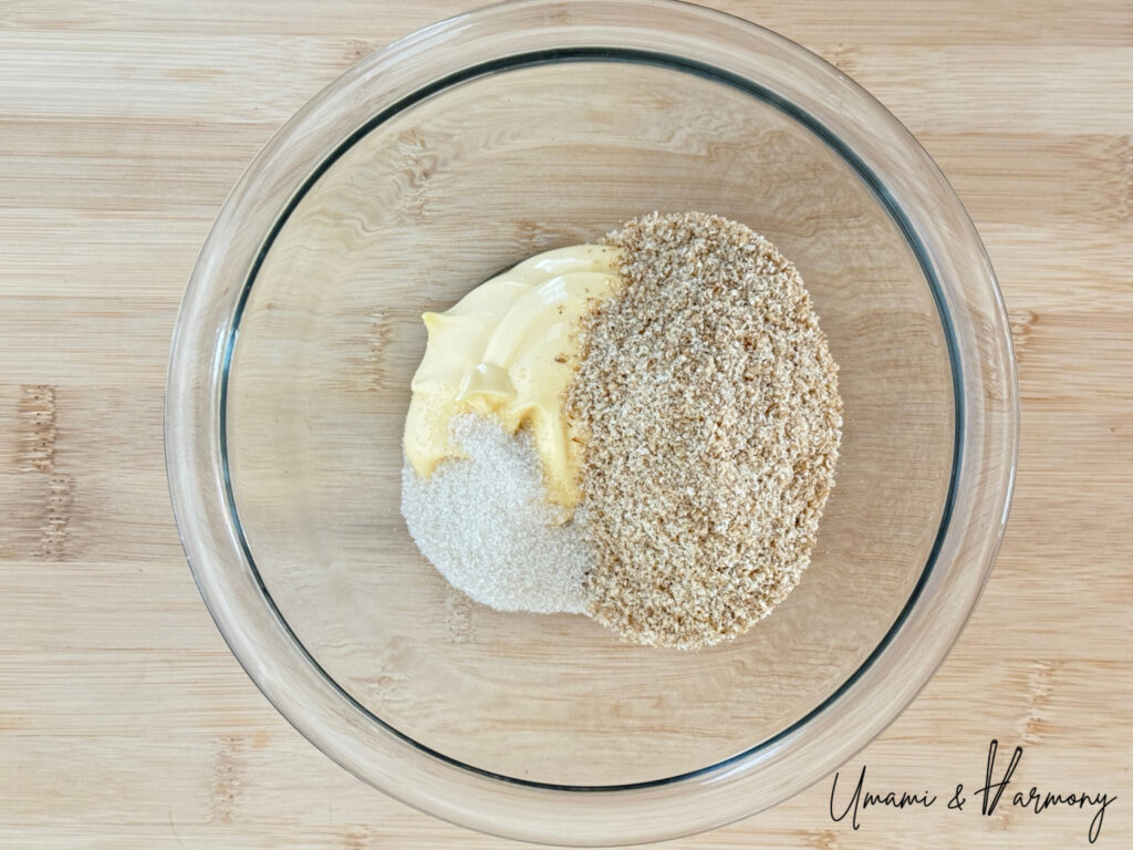 Mayonnaise, ground roasted sesame seeds and sugar added to a bowl