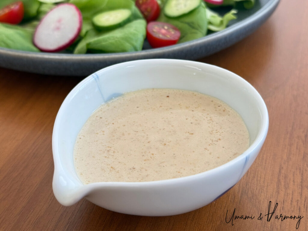 Homemade creamy sesame dressing in a small bowl
