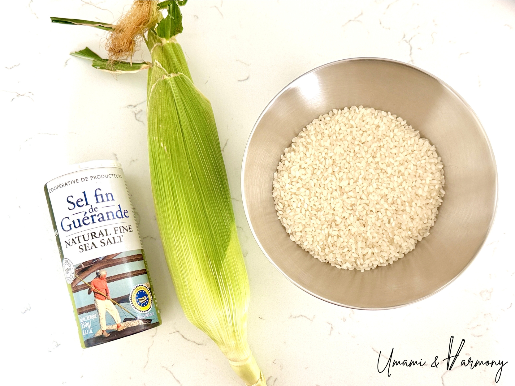 Ingredients for Japanese corn rice including rice, fresh corn and salt.
