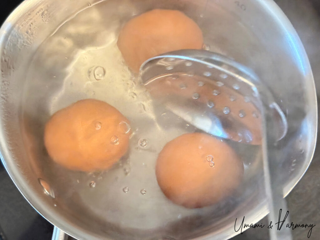 Eggs boiling in a pot