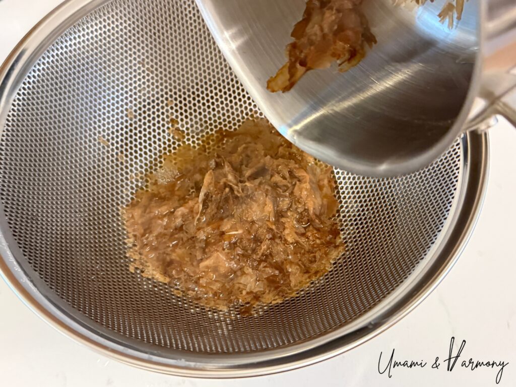 Straining bonito flakes from soup stock