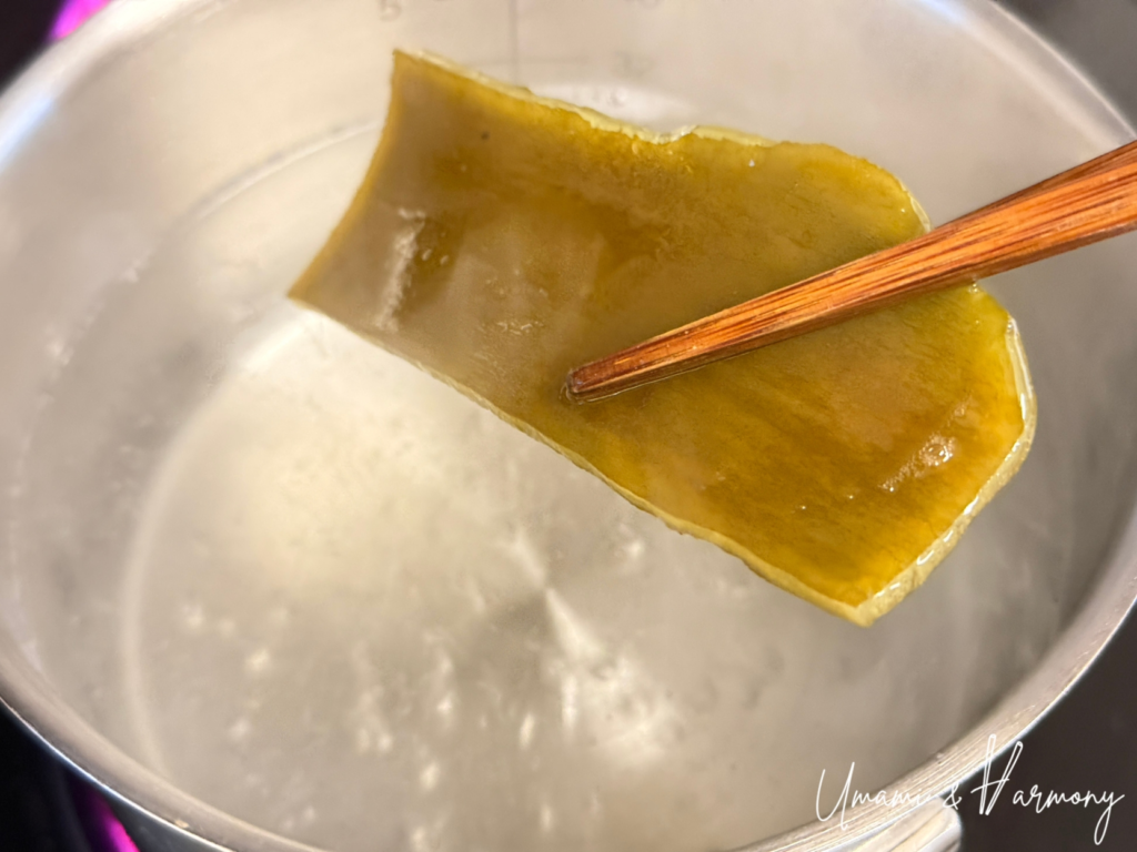 Kombu being removed from the pot before the water boils