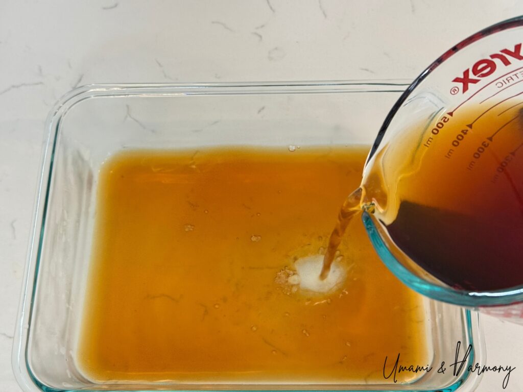 The nanbanzuke marinade being transferred to a shallow dish
